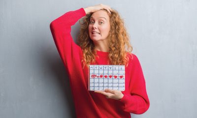 lady in red holding calendar