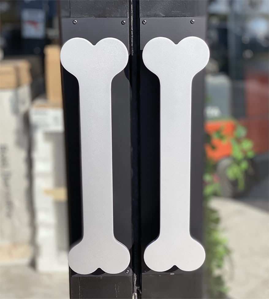 Bone-shaped door handles at Wet Nose in Geneva, IL, greet customers.